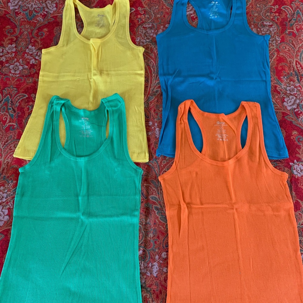 4  Tanks NWOT  ( orange , blue , yellow , green )